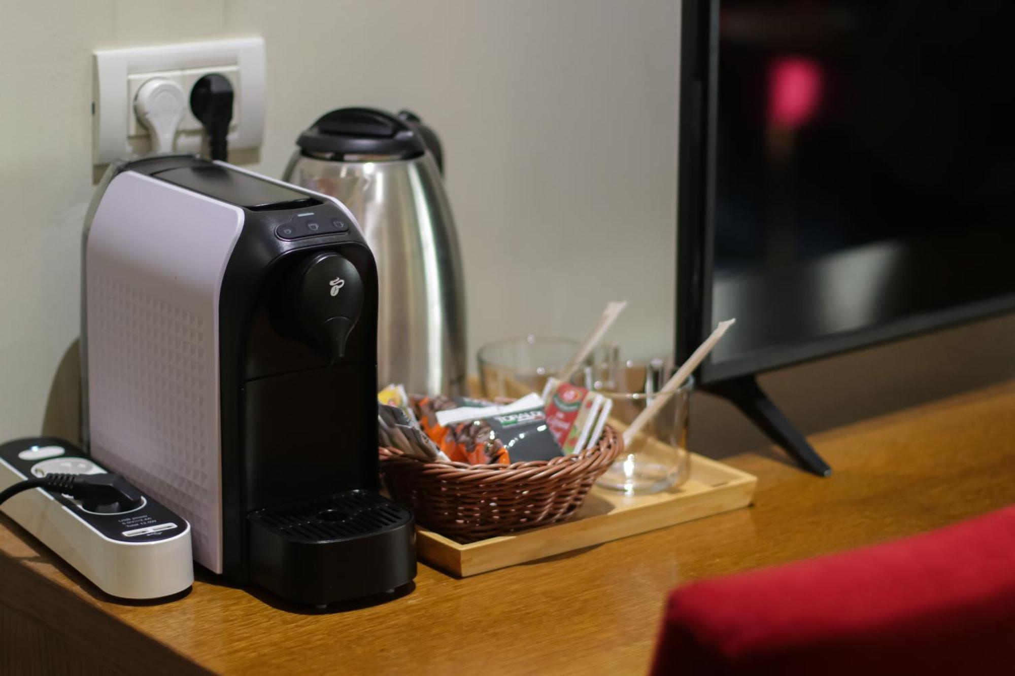 Opus Villa Sinaia Luaran gambar A Nespresso coffee machine in a hotel room